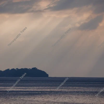 sunrays-piercing-clouds-island