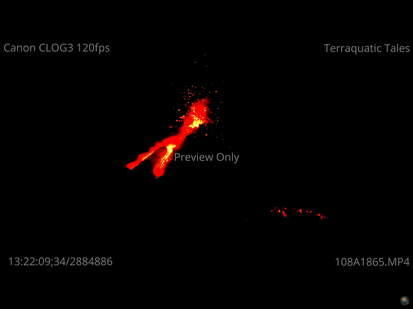 Bright glowing red lava stream erupting from an active volcano at night in India.