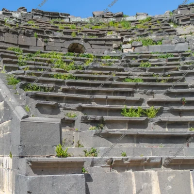 tiered-basalt-cavea-seating-of-the-roman-west-theatre-at-umm-qais-jordan