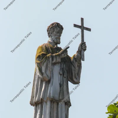 apostle-statue-holding-cross